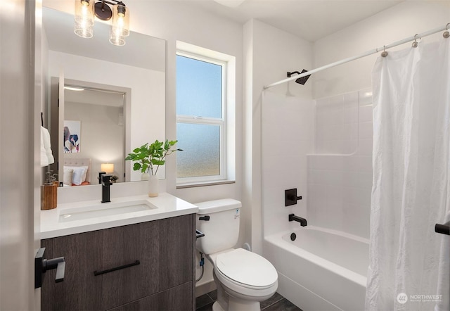 full bathroom with vanity, shower / bath combination with curtain, and toilet