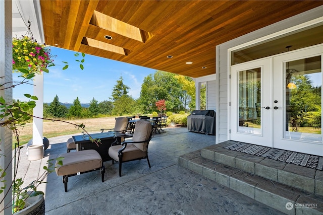 view of patio / terrace featuring a grill and french doors