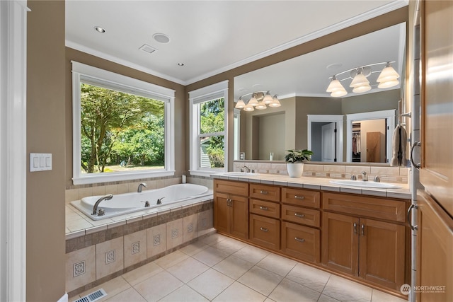 bathroom featuring vanity, ornamental molding, tiled bath, and tile patterned floors