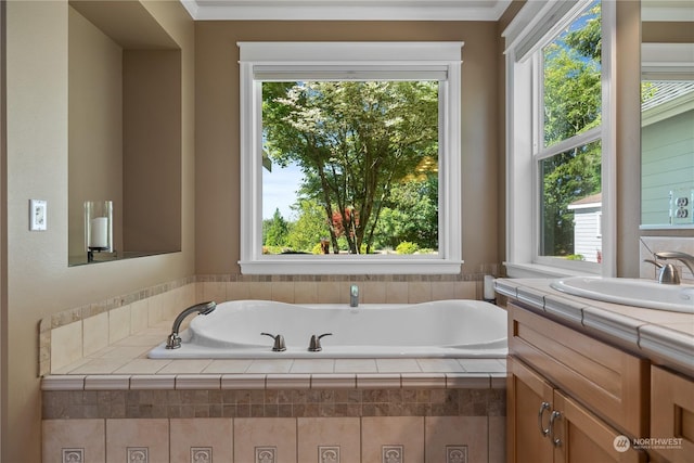 bathroom with vanity, ornamental molding, and a relaxing tiled tub