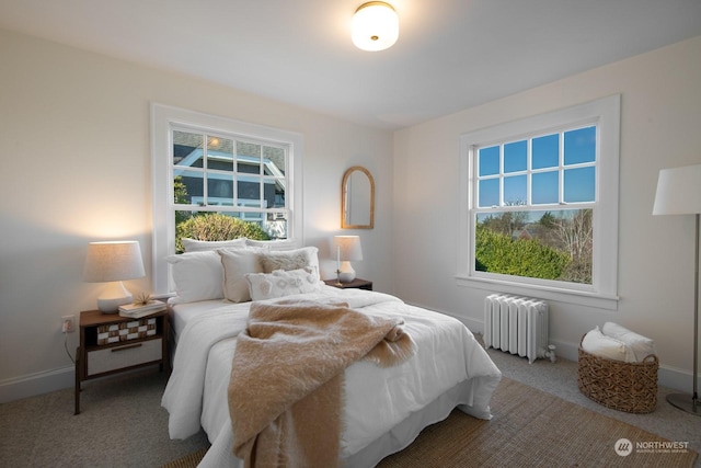 bedroom with carpet floors and radiator