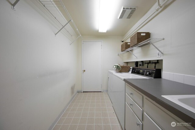 laundry area with sink and washing machine and dryer