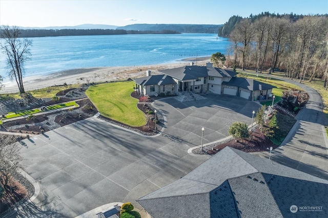 aerial view featuring a water view and a beach view