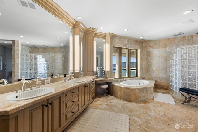 bathroom featuring vanity, shower with separate bathtub, and tile walls