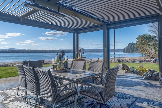 view of patio / terrace featuring a water view and a pergola