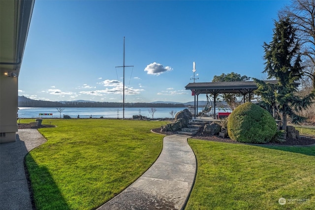 view of yard featuring a gazebo and a water view