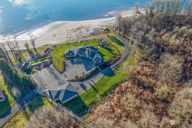 drone / aerial view featuring a water view and a beach view