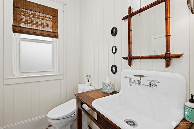 bathroom featuring toilet and a sink