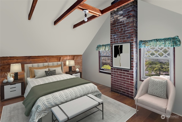 bedroom with vaulted ceiling with beams and wood finished floors