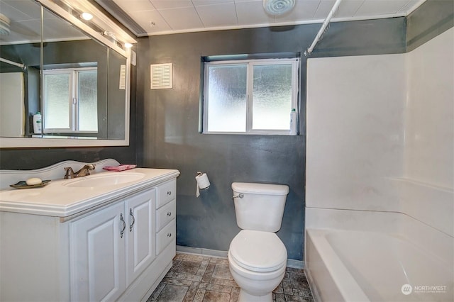 full bathroom with washtub / shower combination, vanity, and toilet