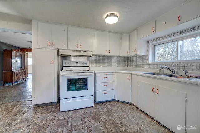 kitchen with tasteful backsplash, sink, white electric range, and white cabinets