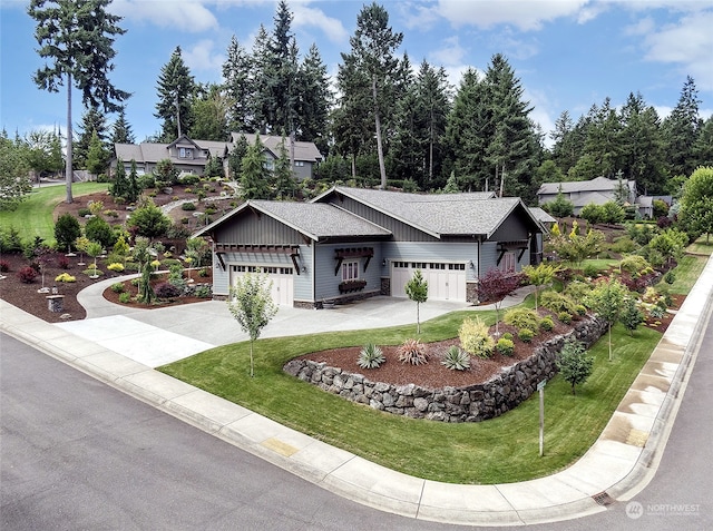 view of front of house with a garage and a front yard