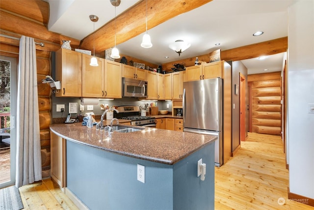 kitchen with log walls, stainless steel appliances, kitchen peninsula, and light wood-type flooring