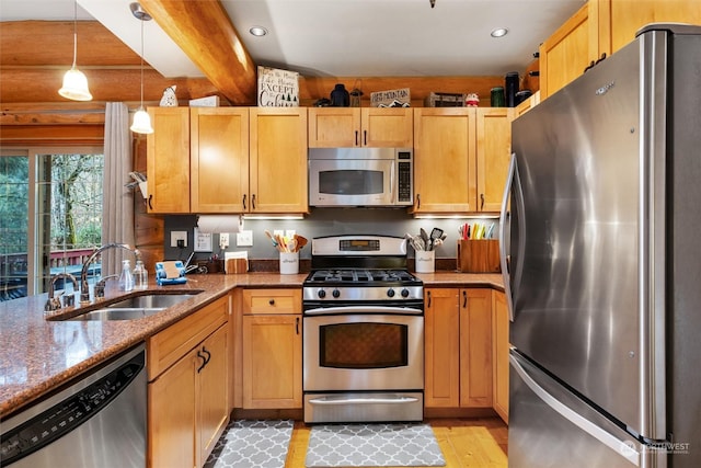 kitchen with beamed ceiling, sink, hanging light fixtures, stainless steel appliances, and light stone countertops