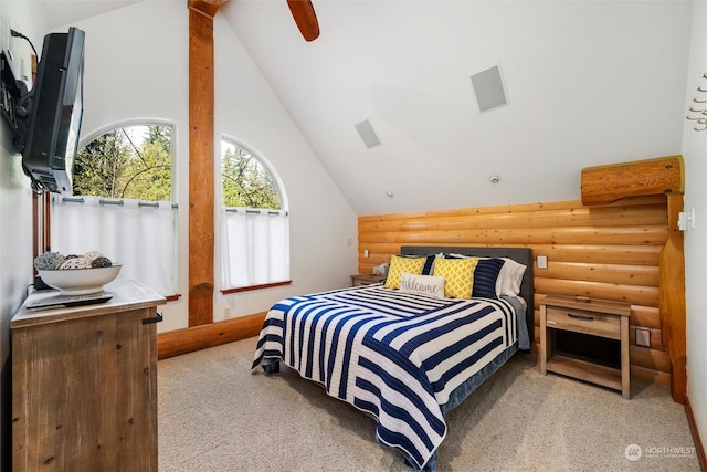 carpeted bedroom with lofted ceiling, rustic walls, and ceiling fan