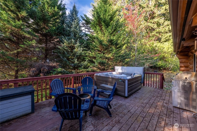 deck featuring area for grilling and a hot tub