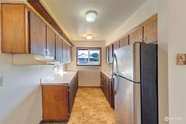 kitchen featuring stainless steel fridge