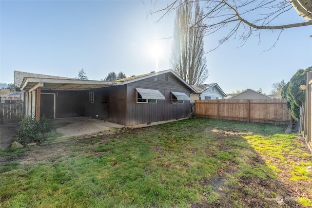 rear view of property with a lawn