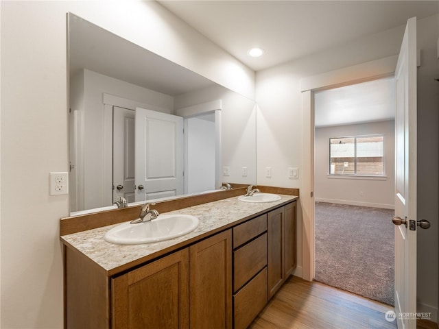 bathroom featuring vanity and wood-type flooring