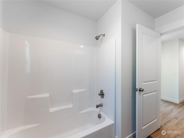 bathroom featuring shower / bath combination and wood-type flooring