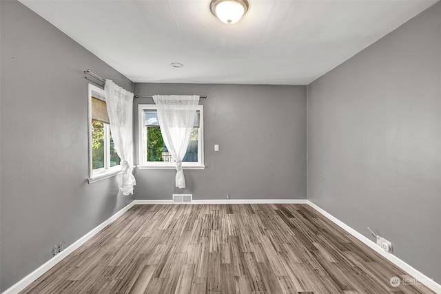 empty room featuring wood-type flooring