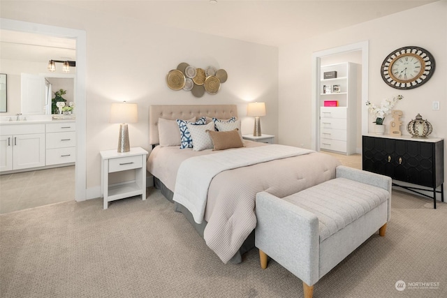 bedroom with sink and ensuite bath