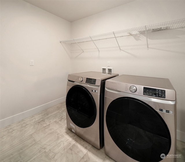 laundry room featuring separate washer and dryer