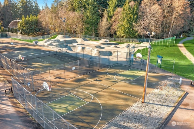 view of home's community featuring basketball hoop