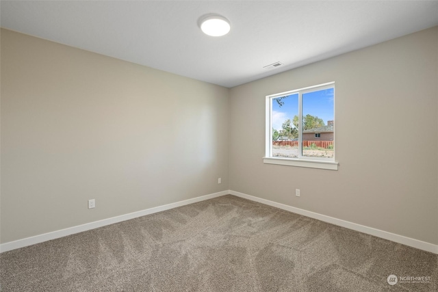 unfurnished room with carpet floors