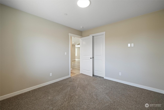 unfurnished bedroom with carpet