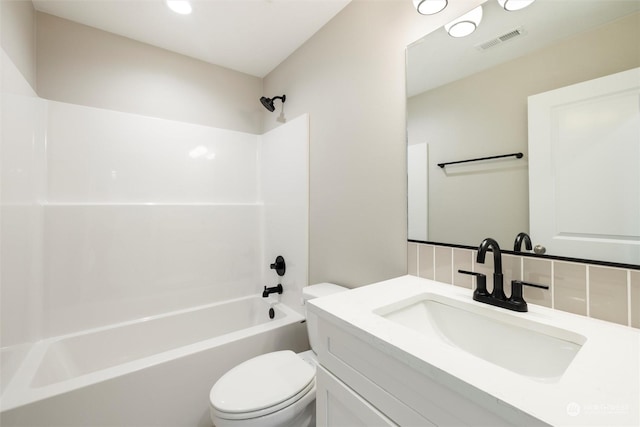 full bathroom with vanity, backsplash, shower / washtub combination, and toilet