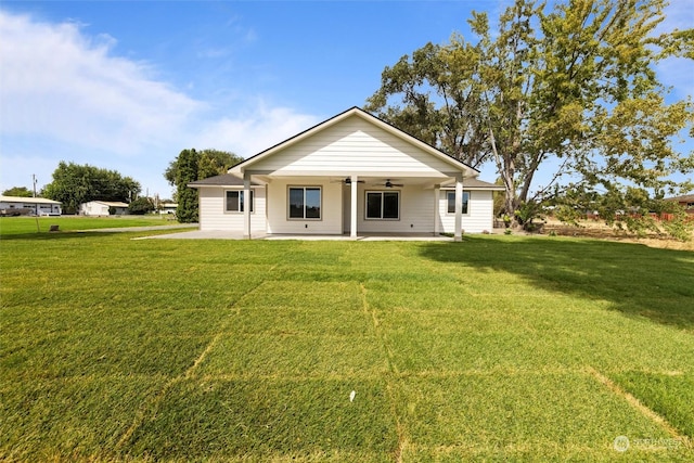 back of house featuring a lawn, a patio, and ceiling fan