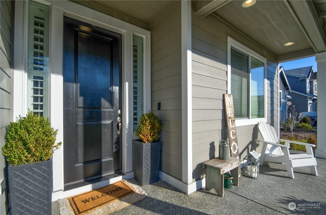 doorway to property with a porch