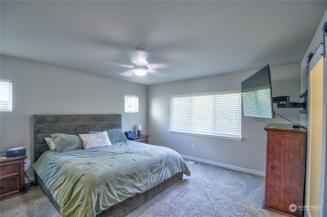 carpeted bedroom with ceiling fan