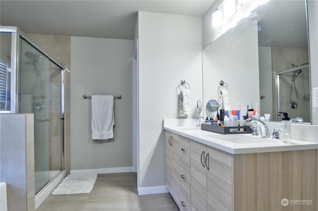 bathroom featuring vanity and a shower with shower door