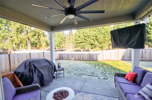 view of patio featuring a grill, ceiling fan, and a fire pit