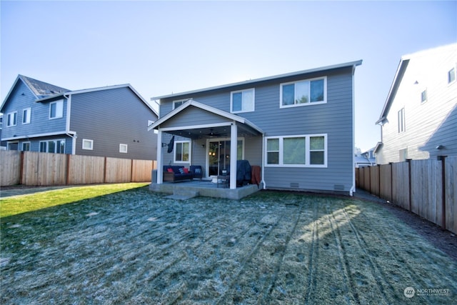 rear view of property with a patio area and a lawn