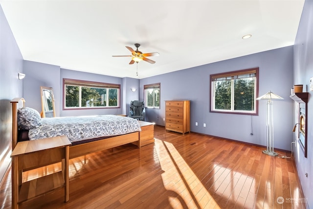 bedroom featuring wood-type flooring and ceiling fan