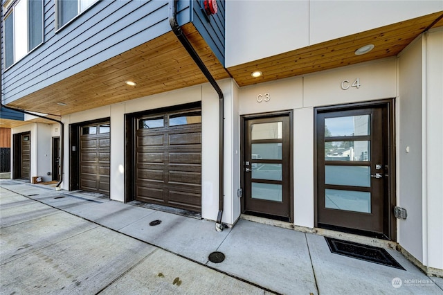 entrance to property featuring a garage