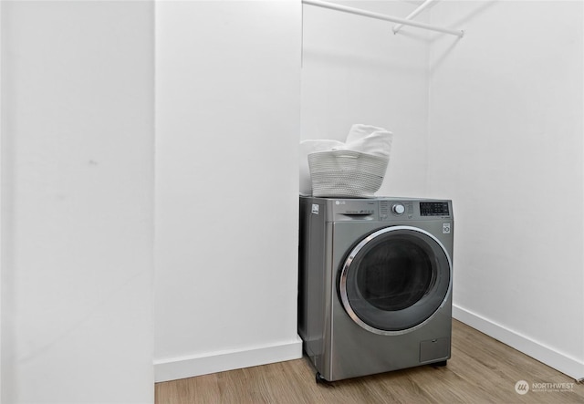 washroom featuring washer / dryer and hardwood / wood-style floors