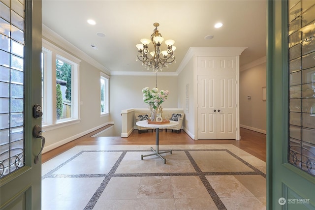 interior space with a notable chandelier and ornamental molding