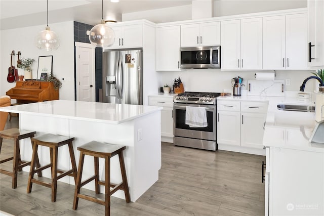 kitchen featuring white cabinetry, appliances with stainless steel finishes, and sink