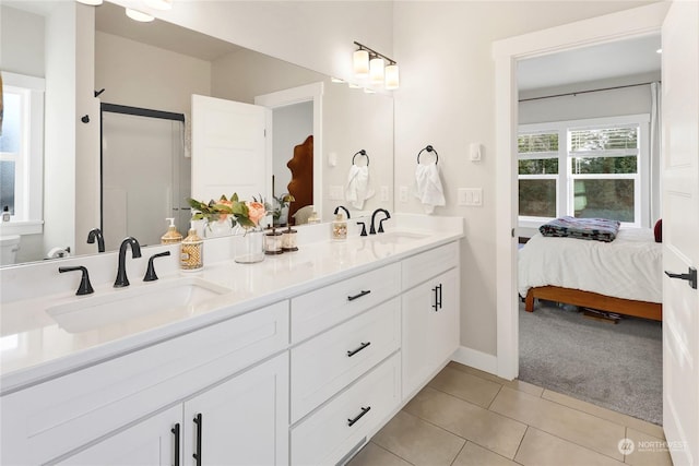 bathroom with tile patterned floors and vanity