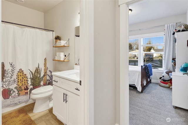 bathroom featuring vanity and toilet