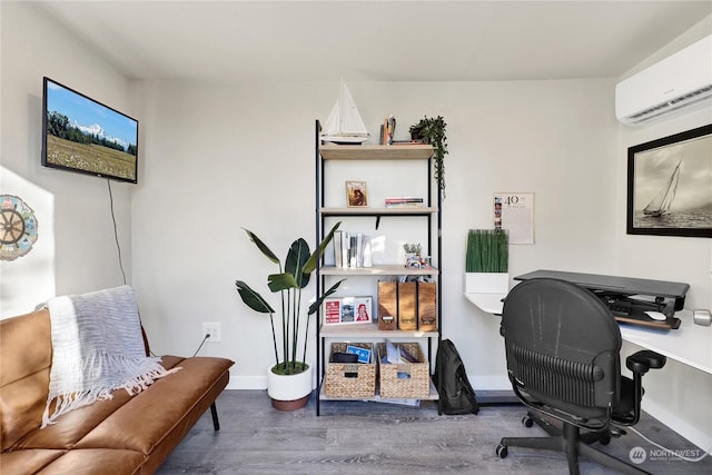 office space featuring hardwood / wood-style floors and a wall mounted AC