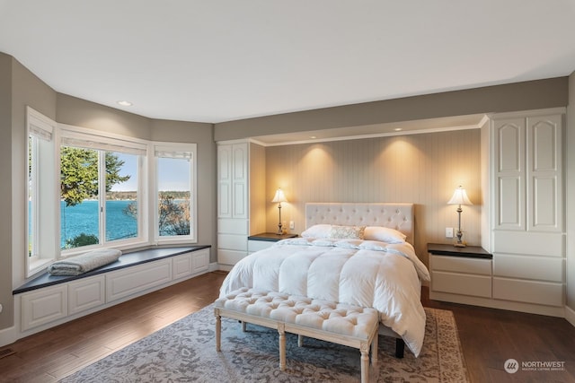 bedroom featuring dark wood-style floors, baseboards, and recessed lighting