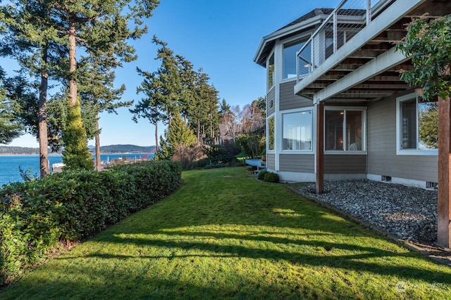 view of yard with a water view