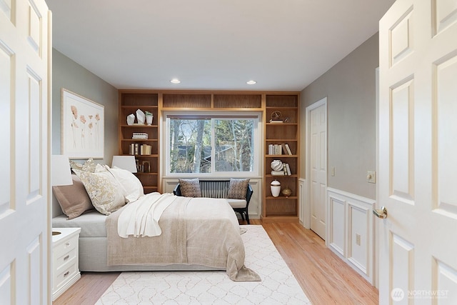 bedroom with light wood-style flooring and recessed lighting