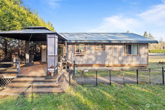 back of property featuring a gazebo