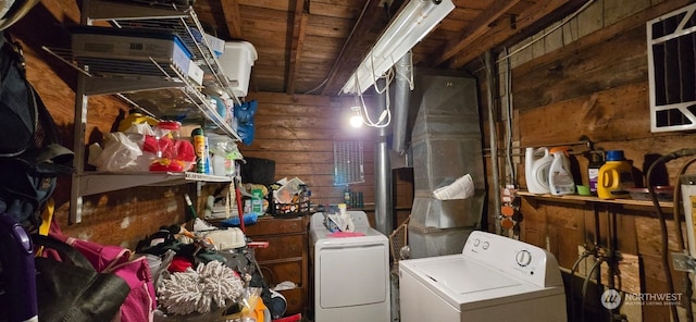 storage area with washer and dryer